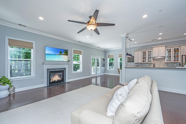 1721 Wellstead St, Mount Pleasant, SC 29466 - living area featuring plenty of natural light, ornamental molding, recessed lighting, a fireplace with flush hearth, and a ceiling fan