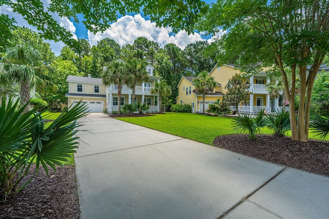 1721 Wellstead St, Mount Pleasant, SC 29466 - view of front facade with driveway, a front yard, a porch, and an attached garage