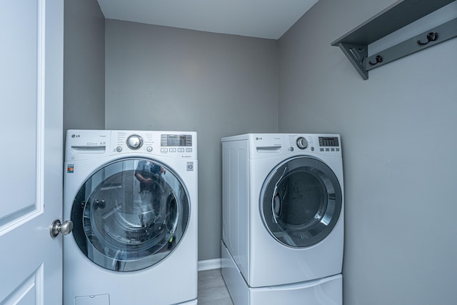1721 Wellstead St, Mount Pleasant, SC 29466 - washroom featuring washing machine and clothes dryer and baseboards