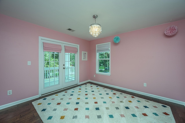 1721 Wellstead St, Mount Pleasant, SC 29466 - unfurnished room with a chandelier, french doors, and dark wood-style flooring