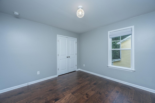 1721 Wellstead St, Mount Pleasant, SC 29466 - unfurnished bedroom with dark wood-style flooring and a closet