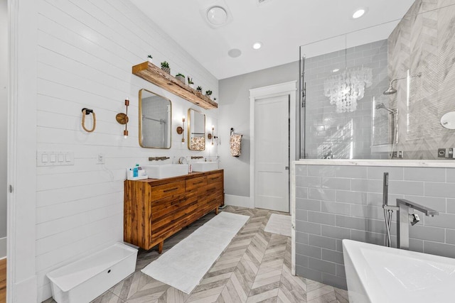 bathroom featuring tile walls, vanity, and shower with separate bathtub