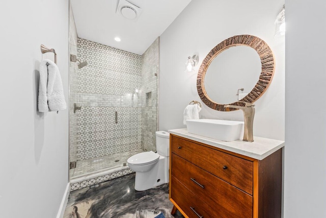 bathroom with a shower with shower door, vanity, and toilet