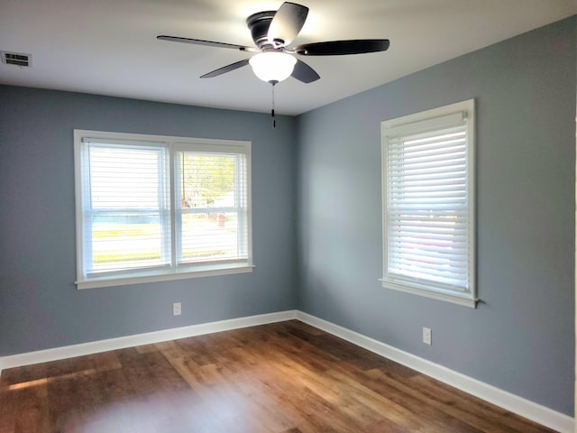 unfurnished room with hardwood / wood-style floors and ceiling fan