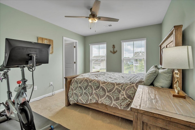 bedroom featuring baseboards, a ceiling fan, carpet flooring, and visible vents