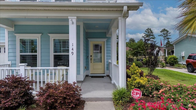 property entrance featuring a porch