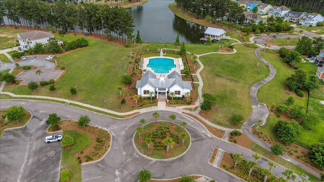 drone / aerial view featuring a water view and a residential view