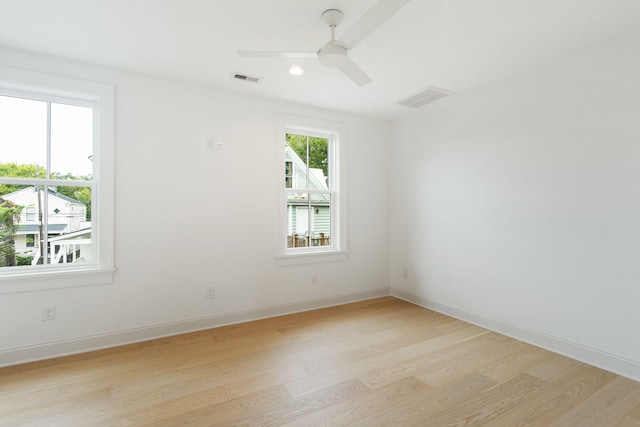 unfurnished room featuring light wood-type flooring and ceiling fan