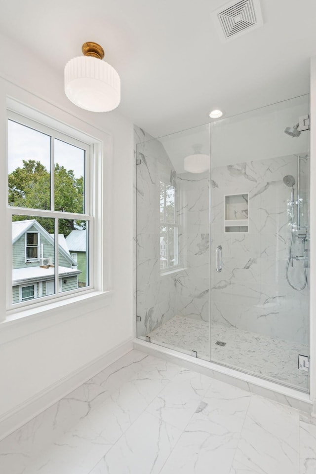 bathroom featuring an enclosed shower