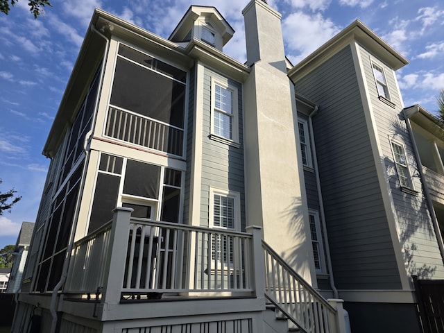 133 Wando Reach Rd, Wando, SC 29492 - view of side of property with a chimney and stairway