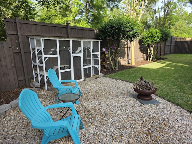 133 Wando Reach Rd, Wando, SC 29492 - view of patio / terrace featuring exterior structure, a fire pit, and an outdoor structure