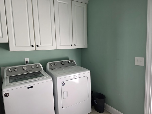 133 Wando Reach Rd, Wando, SC 29492 - laundry room featuring cabinet space, washing machine and dryer, and baseboards