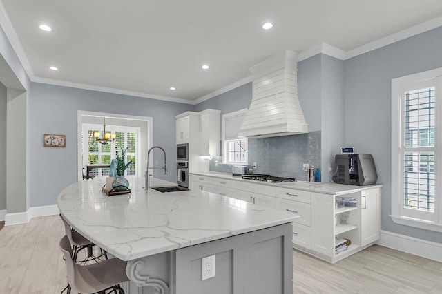 133 Wando Reach Rd, Wando, SC 29492 - kitchen with open shelves, decorative backsplash, crown molding, a chandelier, and white cabinets