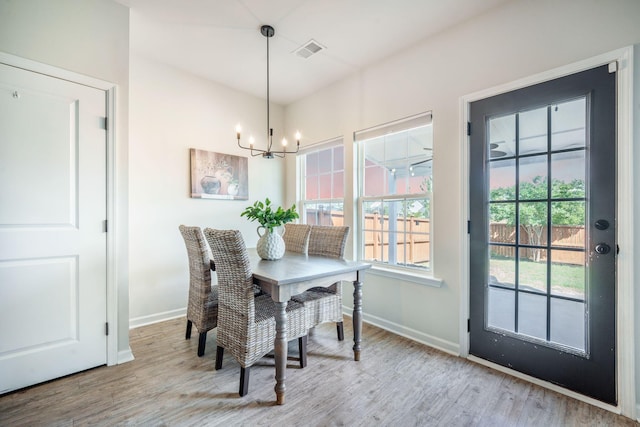 743 Redbud Ln, Summerville, SC 29486 - dining space with a chandelier, baseboards, and wood finished floors