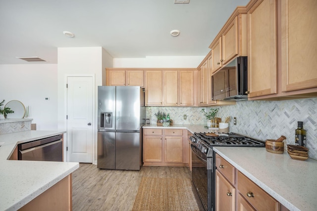 743 Redbud Ln, Summerville, SC 29486 - kitchen featuring stainless steel appliances, tasteful backsplash, light wood-style floors, and light brown cabinetry