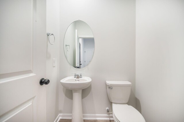 743 Redbud Ln, Summerville, SC 29486 - bathroom with toilet, baseboards, and a sink