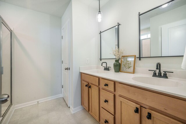 743 Redbud Ln, Summerville, SC 29486 - bathroom featuring double vanity, baseboards, and a shower with door