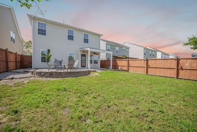 743 Redbud Ln, Summerville, SC 29486 - back of house at dusk featuring a patio and a ceiling fan