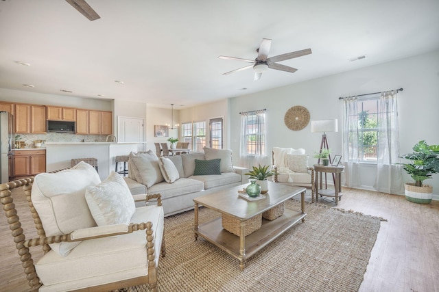 743 Redbud Ln, Summerville, SC 29486 - living room featuring ceiling fan and light wood finished floors