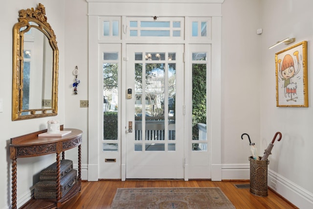 doorway with hardwood / wood-style floors