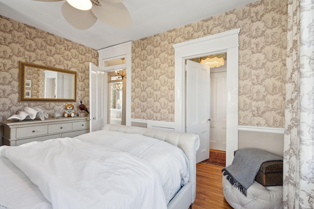 bedroom with hardwood / wood-style flooring and ceiling fan