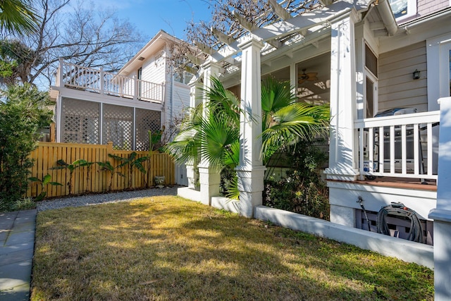 view of yard featuring a pergola and ceiling fan