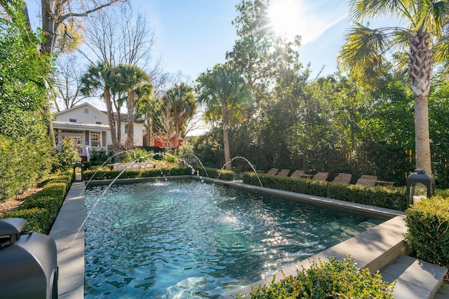 view of pool with pool water feature