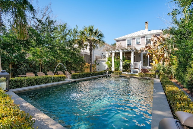 view of swimming pool featuring a pergola and pool water feature