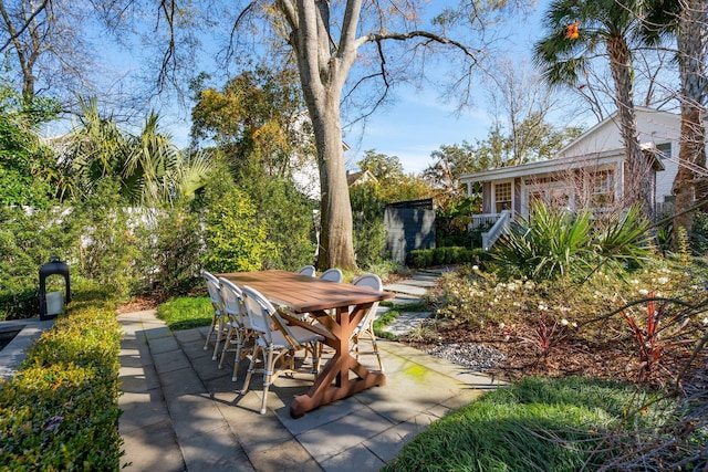 view of patio / terrace featuring a storage unit