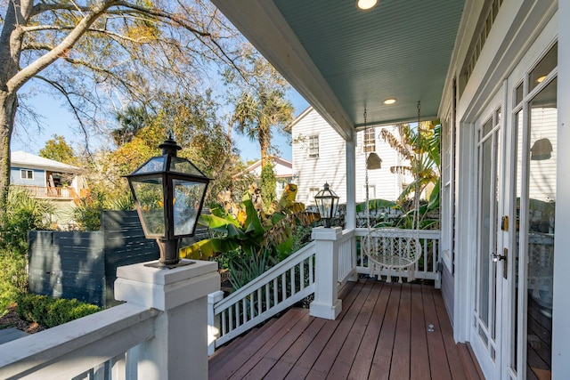 wooden terrace featuring covered porch