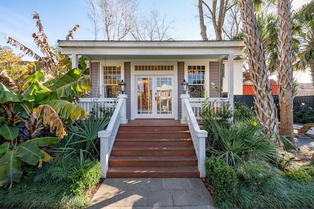 property entrance featuring french doors and a porch