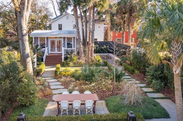 view of front facade with french doors and a patio area