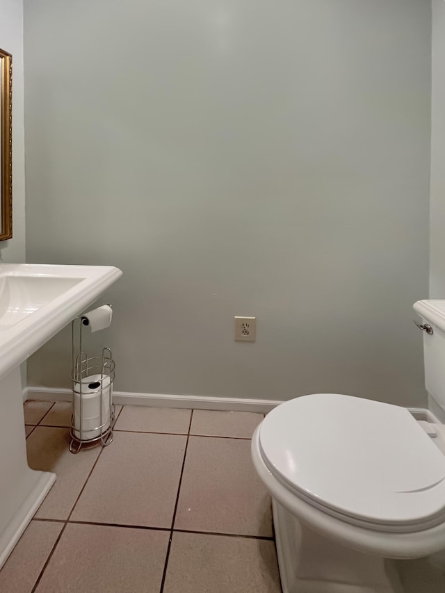 bathroom featuring tile patterned flooring and toilet