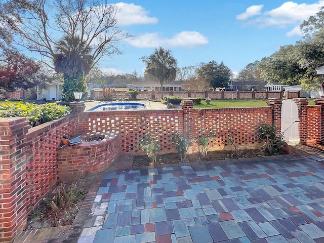 view of patio / terrace featuring a pool