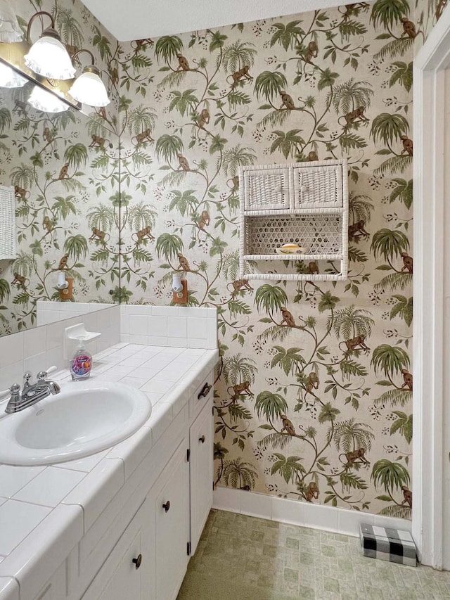 bathroom featuring tile patterned flooring and vanity