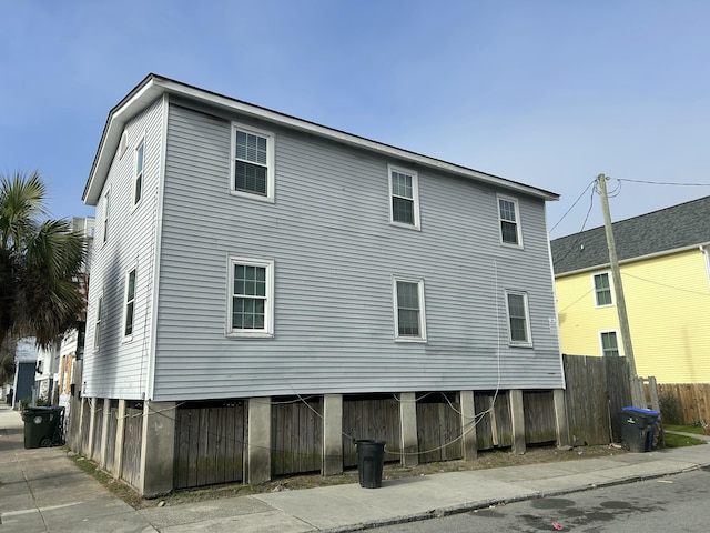 back of house featuring fence