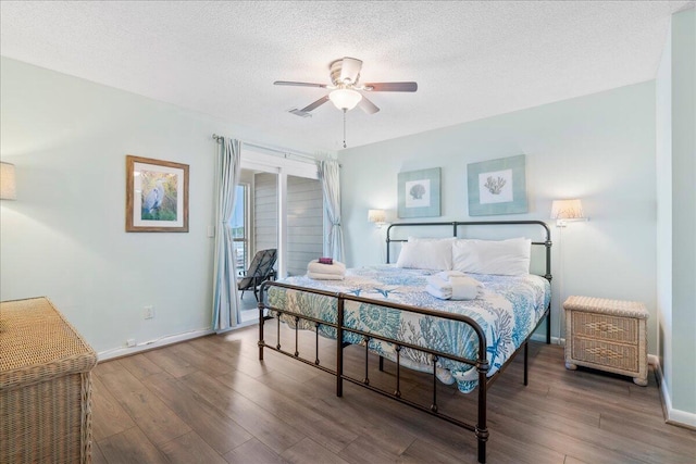 bedroom featuring a textured ceiling, hardwood / wood-style flooring, and ceiling fan