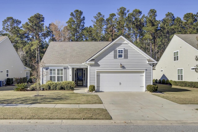 view of front facade featuring driveway, a front yard, and a garage
