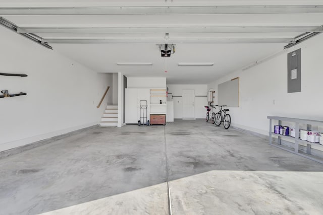 garage featuring electric panel and a garage door opener