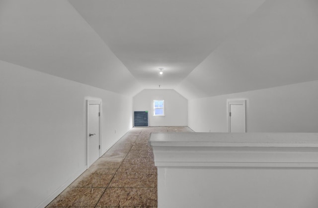 additional living space with lofted ceiling