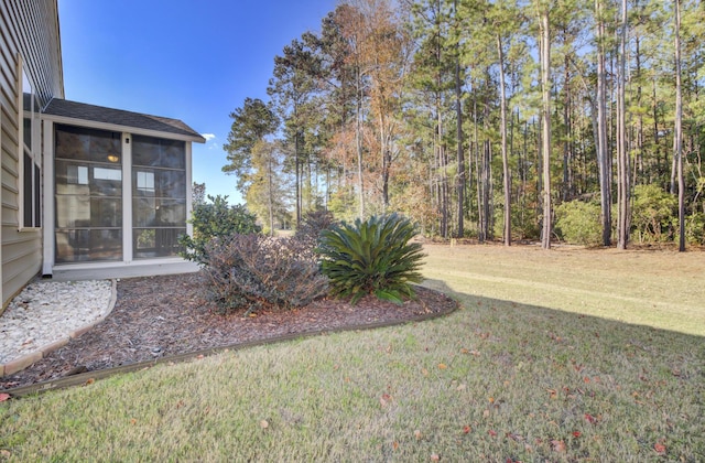 view of yard featuring a sunroom