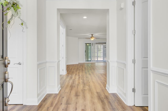 hall with recessed lighting and light wood-style floors