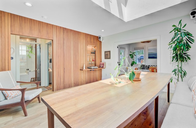 11 Francis St, Charleston, SC 29403 - dining space featuring light wood-style floors, recessed lighting, and wood walls