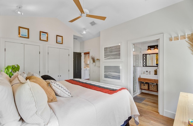 11 Francis St, Charleston, SC 29403 - bedroom with vaulted ceiling, ensuite bath, light wood-style flooring, two closets, and ceiling fan