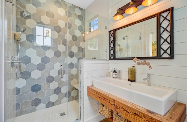 11 Francis St, Charleston, SC 29403 - full bath with a shower stall, a sink, tile walls, and decorative backsplash