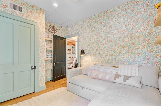 11 Francis St, Charleston, SC 29403 - bedroom with wallpapered walls, wood finished floors, and recessed lighting