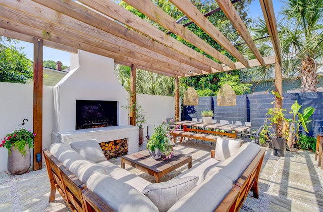 11 Francis St, Charleston, SC 29403 - fenced backyard featuring an outdoor living space with a fireplace, a patio area, and outdoor dining area