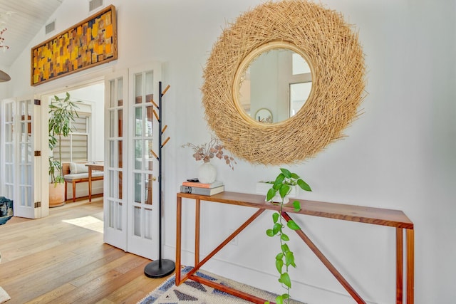 11 Francis St, Charleston, SC 29403 - entryway with french doors, wood finished floors, and high vaulted ceiling