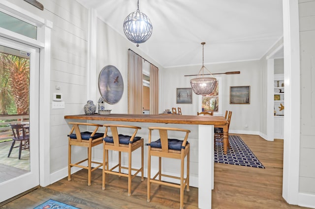 dining room featuring hardwood / wood-style flooring, plenty of natural light, and a notable chandelier