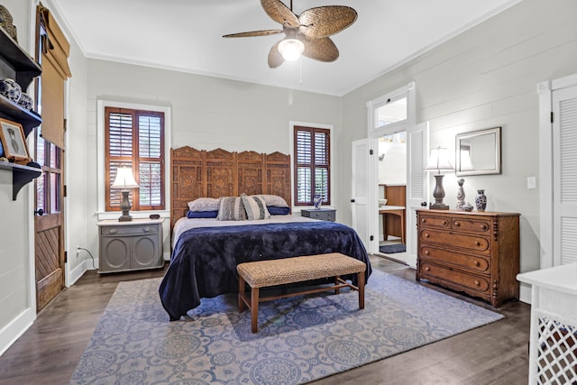 bedroom featuring ceiling fan, dark hardwood / wood-style flooring, crown molding, and multiple windows